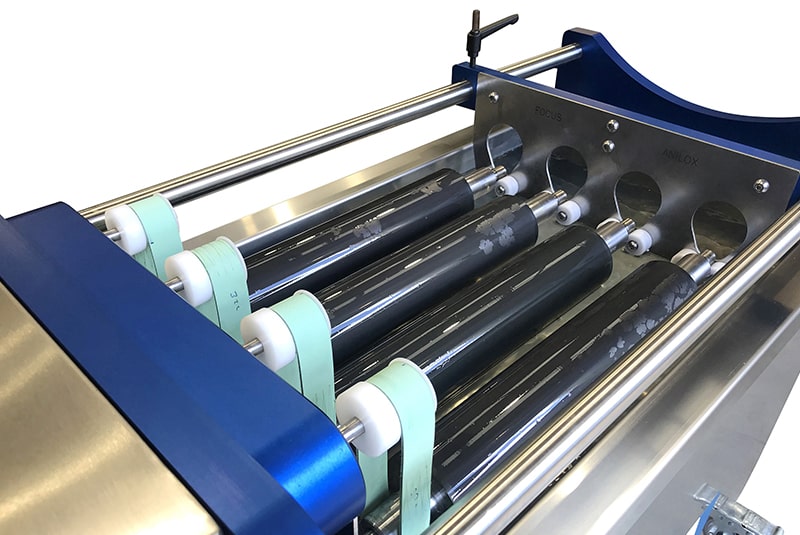 An ultrasonic anilox roll cleaning machine, cleaning the rolls on a printing machine