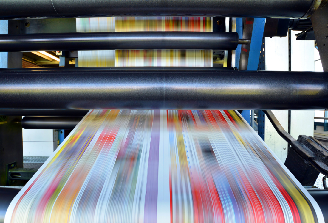 High-speed flexographic printing press producing colourful packaging designs, showcasing how modern trends influence print technology.