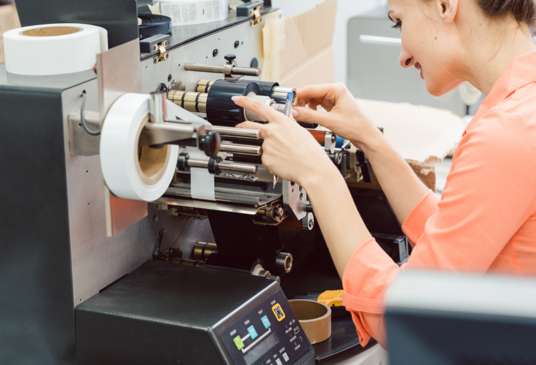 Woman testing the latest textile label printing technologies. 