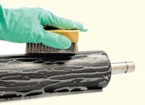 An Ultrasonic Anilox Roll that is being cleaned because it is beneficial for numerous reasons.